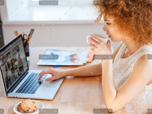 demo attachment 218 woman photographer drinking coffee and working pjnbp6u@2x